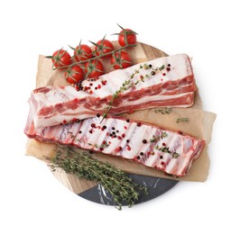 Photo of Raw pork ribs with spices and tomatoes isolated on white, top view