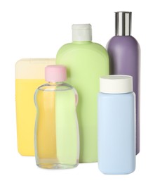 Photo of Bottles of baby cosmetic products on white background