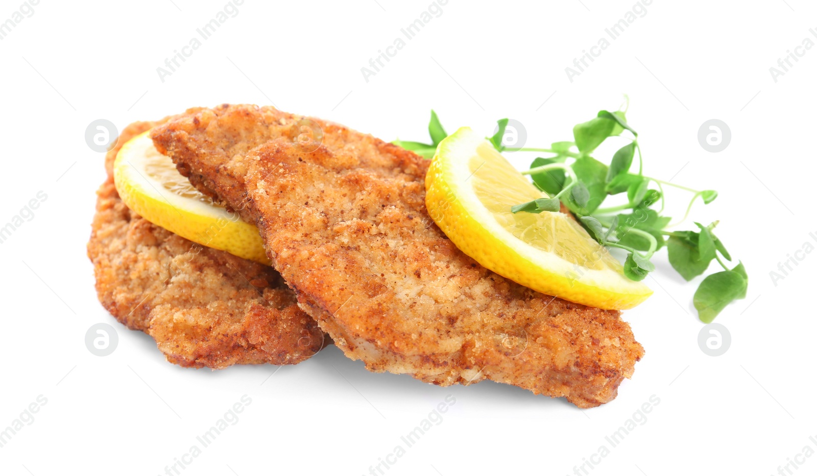 Photo of Delicious schnitzels with lemon and microgreens on white background