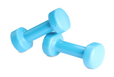 Photo of Light blue dumbbells isolated on white. Sports equipment