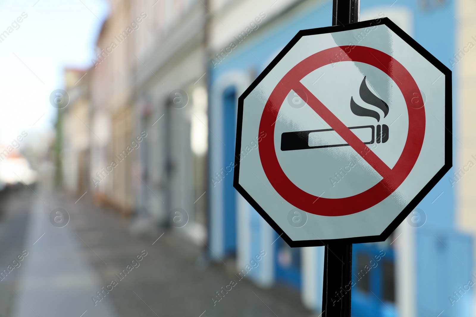 Image of Sign No Smoking on city street. Space for text