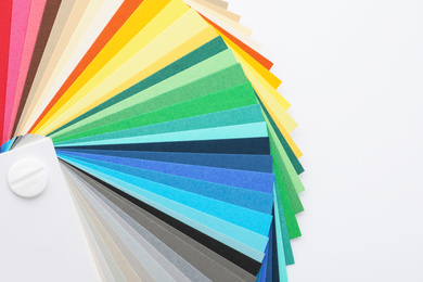 Photo of Color palette samples on white background top view