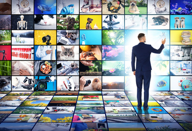 Image of Media library concept. Man using virtual video gallery