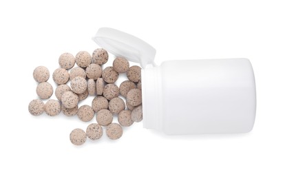 Plastic jar with brewer's yeast tablets isolated on white, top view