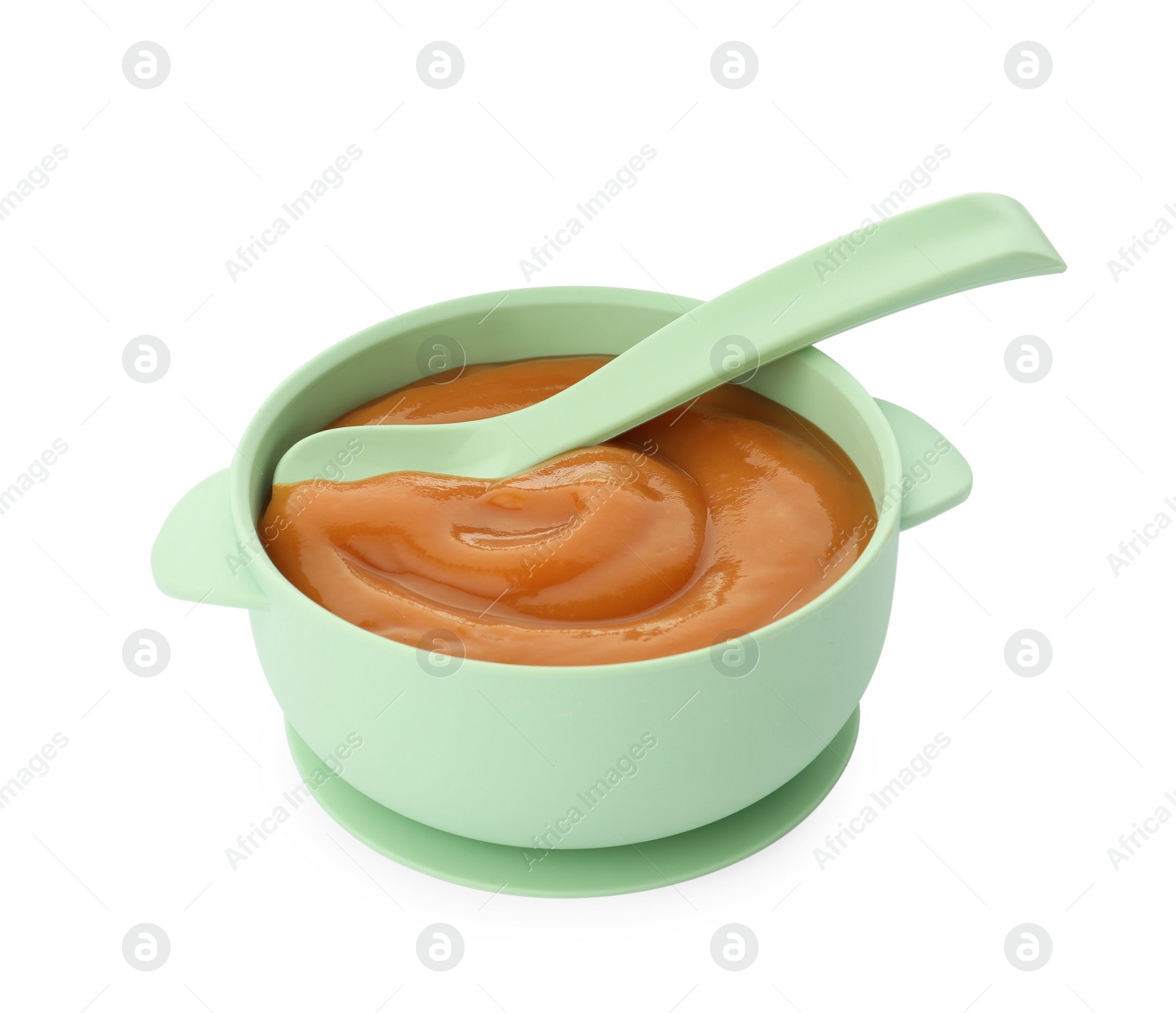 Photo of Bowl and spoon with tasty pureed baby food isolated on white