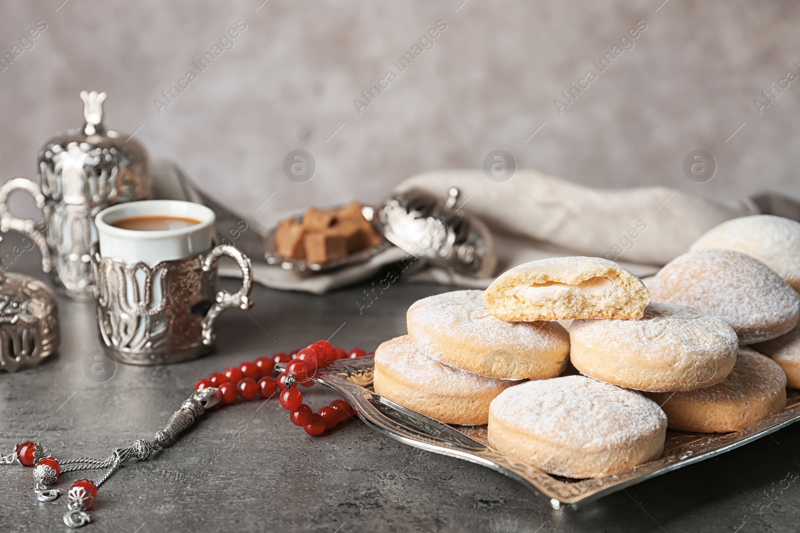 Photo of Composition with traditional cookies for Islamic holidays on table. Eid Mubarak