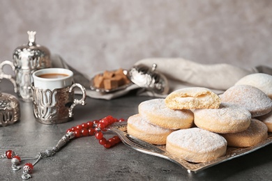 Photo of Composition with traditional cookies for Islamic holidays on table. Eid Mubarak