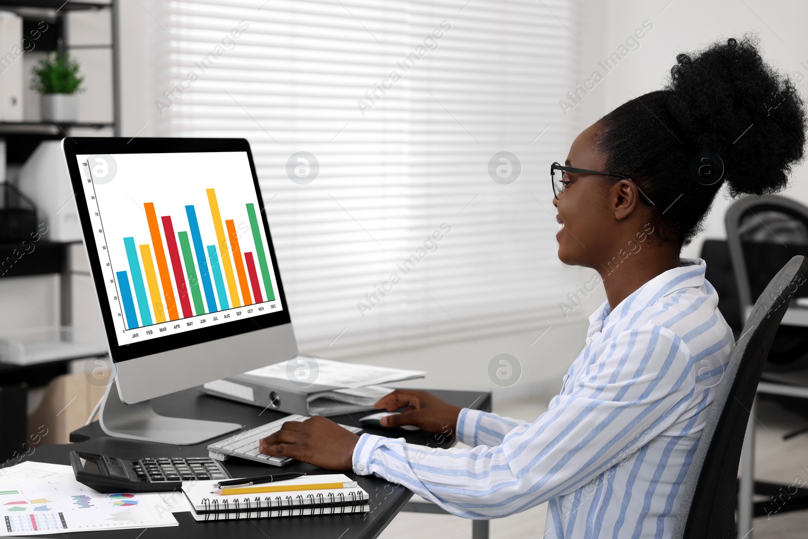 Photo of Professional accountant working on computer at desk in office