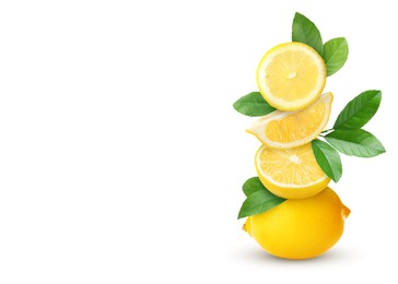 Image of Stacked cut and whole lemons with green leaves on white background