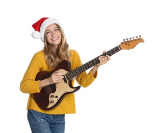 Photo of Young woman in Santa hat playing electric guitar on white background. Christmas music