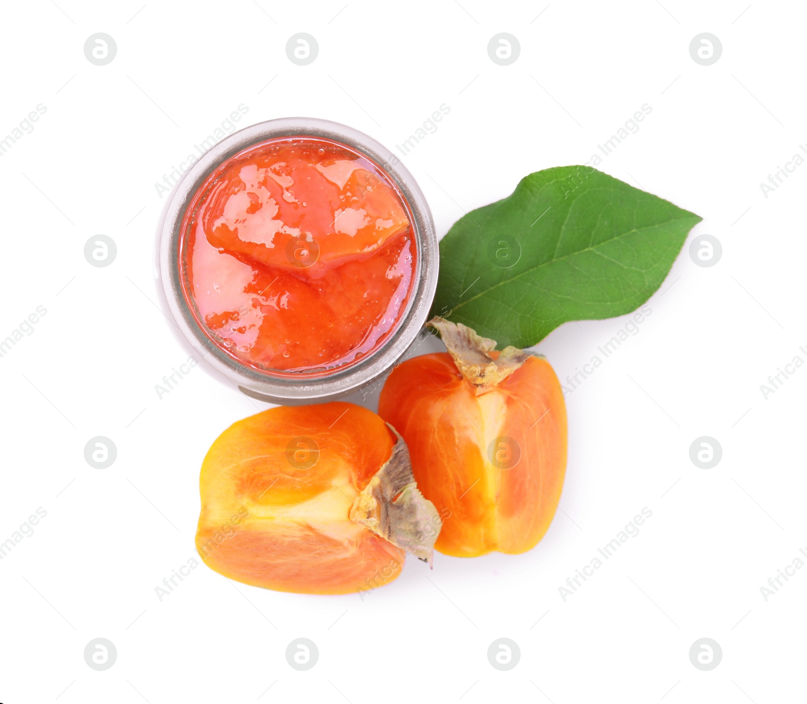 Photo of Jar of tasty persimmon jam and fresh fruits on white background, top view