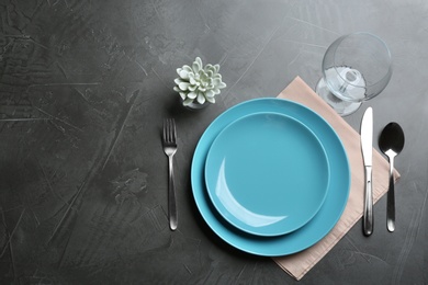 Photo of Elegant table setting on grey background, flat lay. Space for text