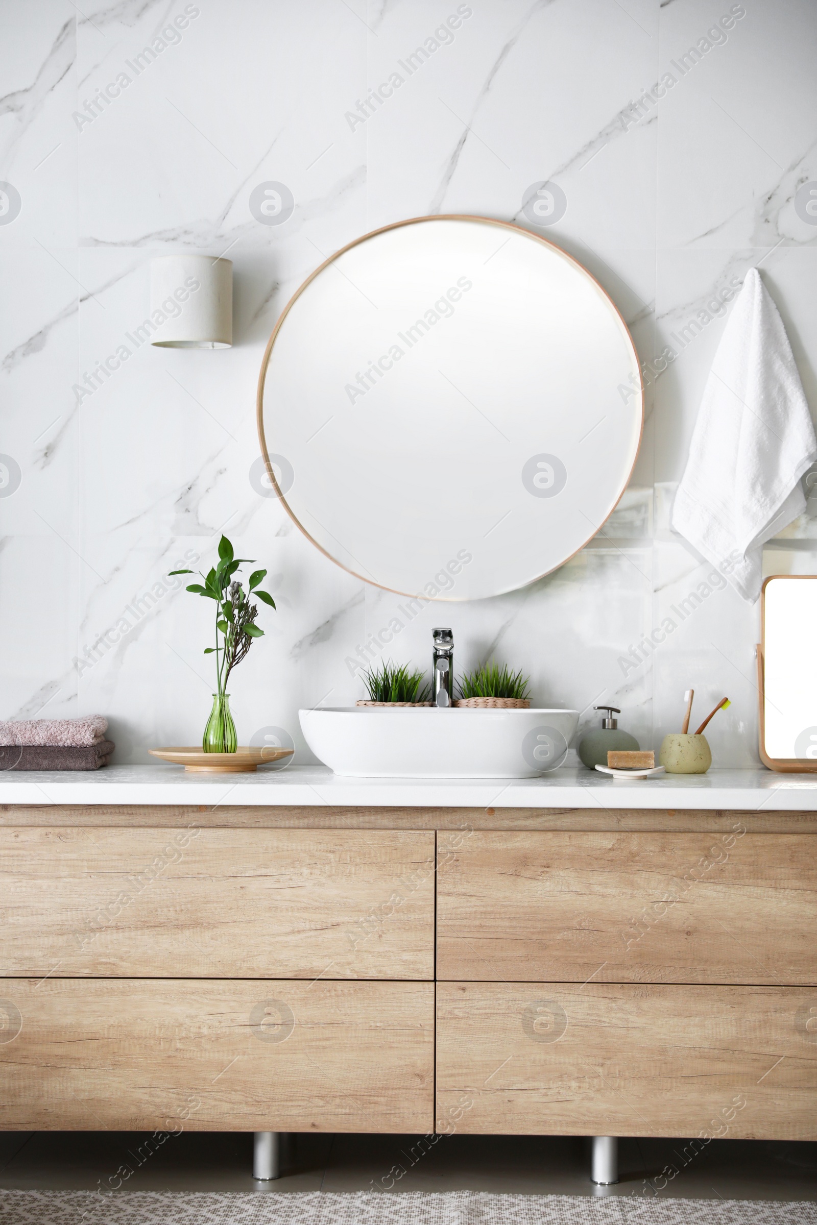 Photo of Modern bathroom interior with stylish mirror and vessel sink