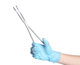 Doctor in sterile glove holding medical forceps on white background