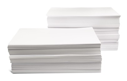 Photo of Stacks of paper sheets on white background