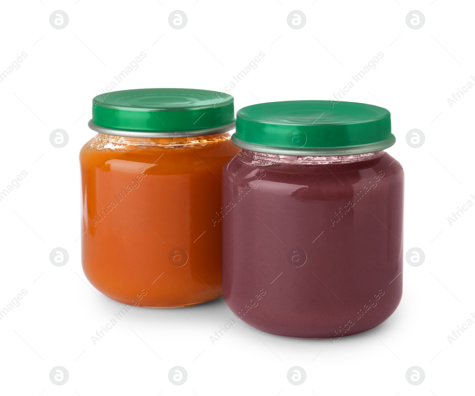 Photo of Glass jars with healthy baby food isolated on white