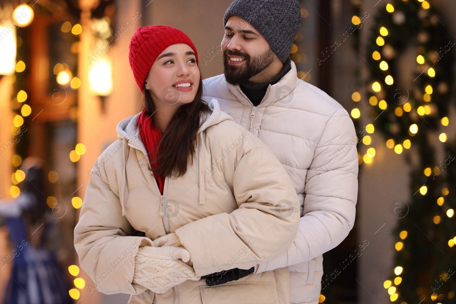 Photo of Lovely couple spending time together on city street