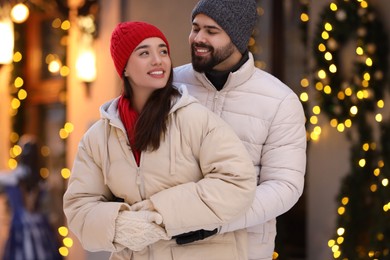 Lovely couple spending time together on city street