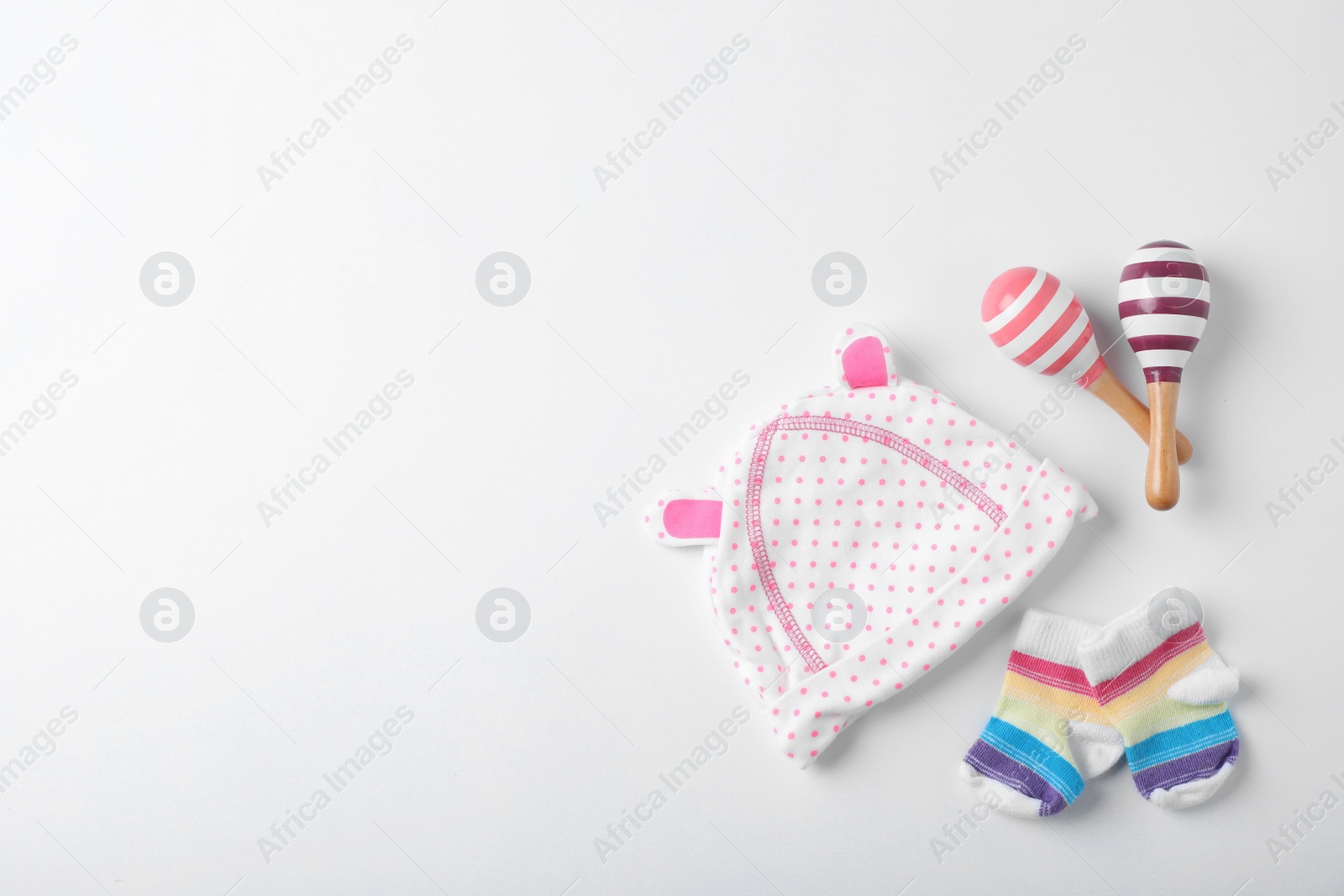 Photo of Flat lay composition with baby clothes and space for text on white background