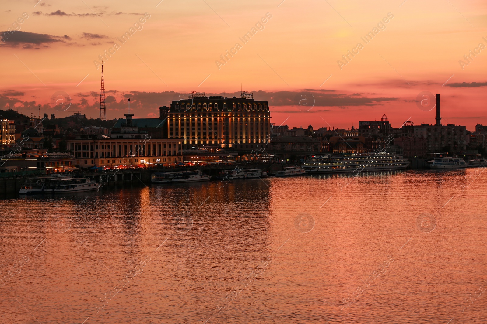 Photo of KYIV, UKRAINE - JUNE 03, 2019: Beautiful view of embankment and Dnipro river at sunset