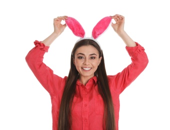 Photo of Portrait of beautiful woman in Easter bunny ears headband on white background