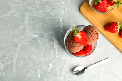 Photo of Flat lay composition with chocolate ice cream and strawberry on grey table, space for text