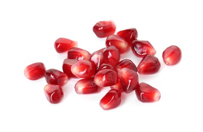 Photo of Pile of tasty pomegranate grains isolated on white