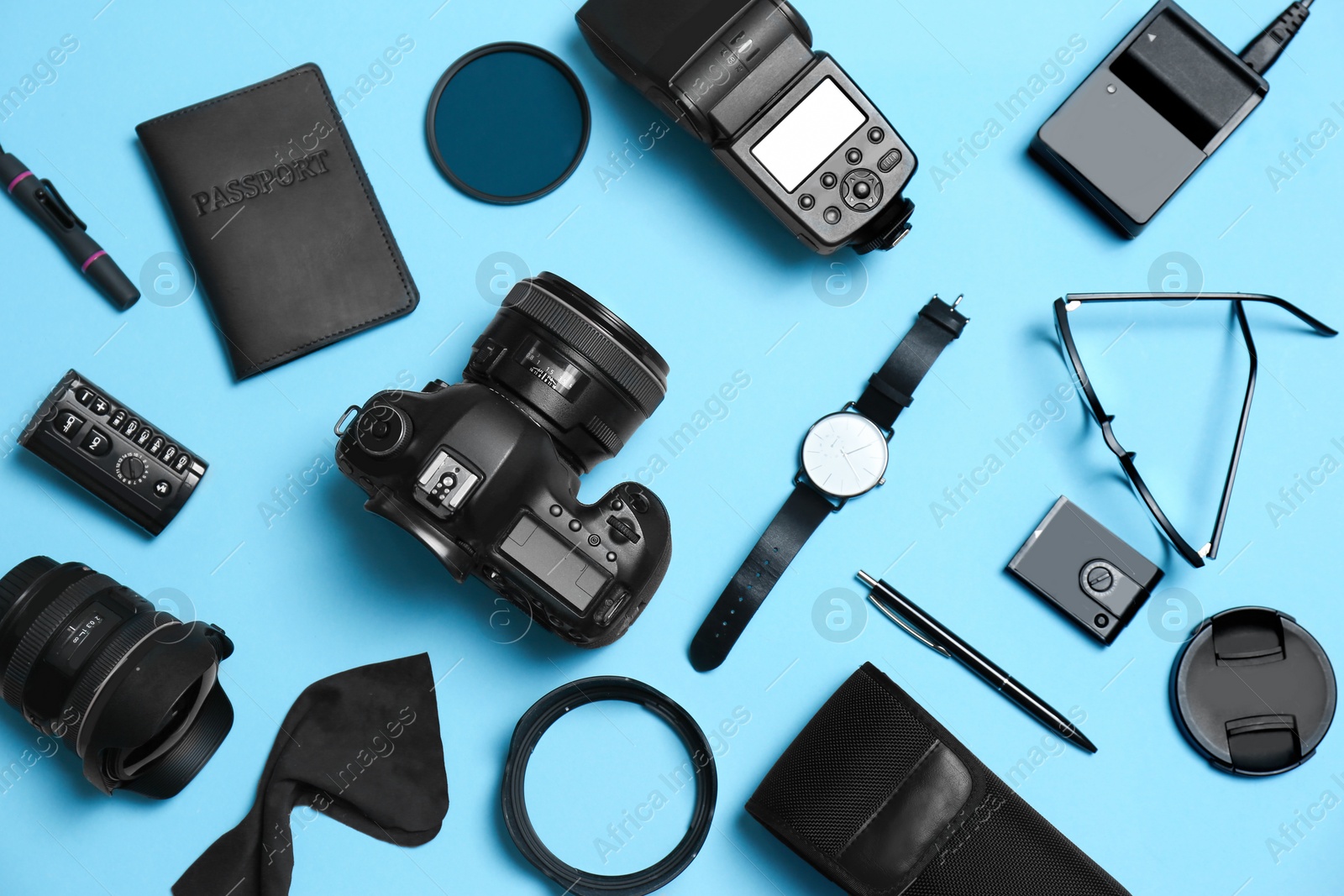 Photo of Flat lay composition with professional photographer equipment and accessories on color background