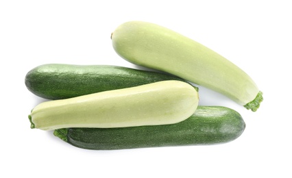 Fresh ripe green zucchinis isolated on white, top view