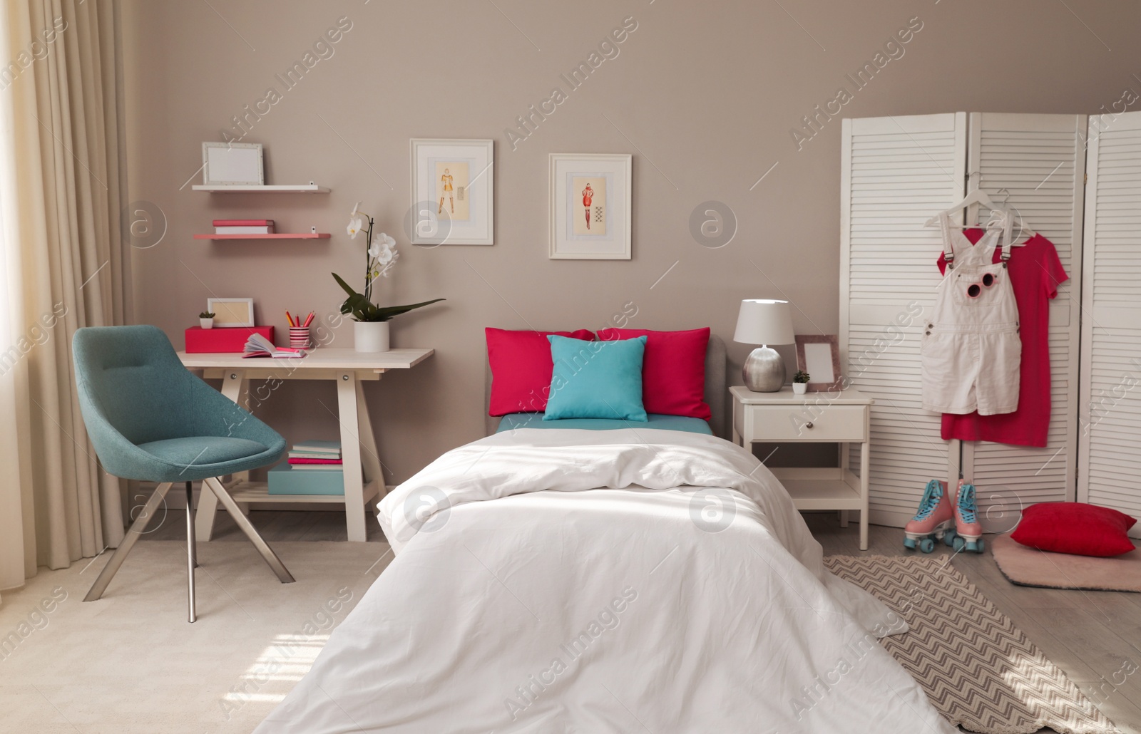 Photo of Modern teenager's room interior with comfortable bed and workplace