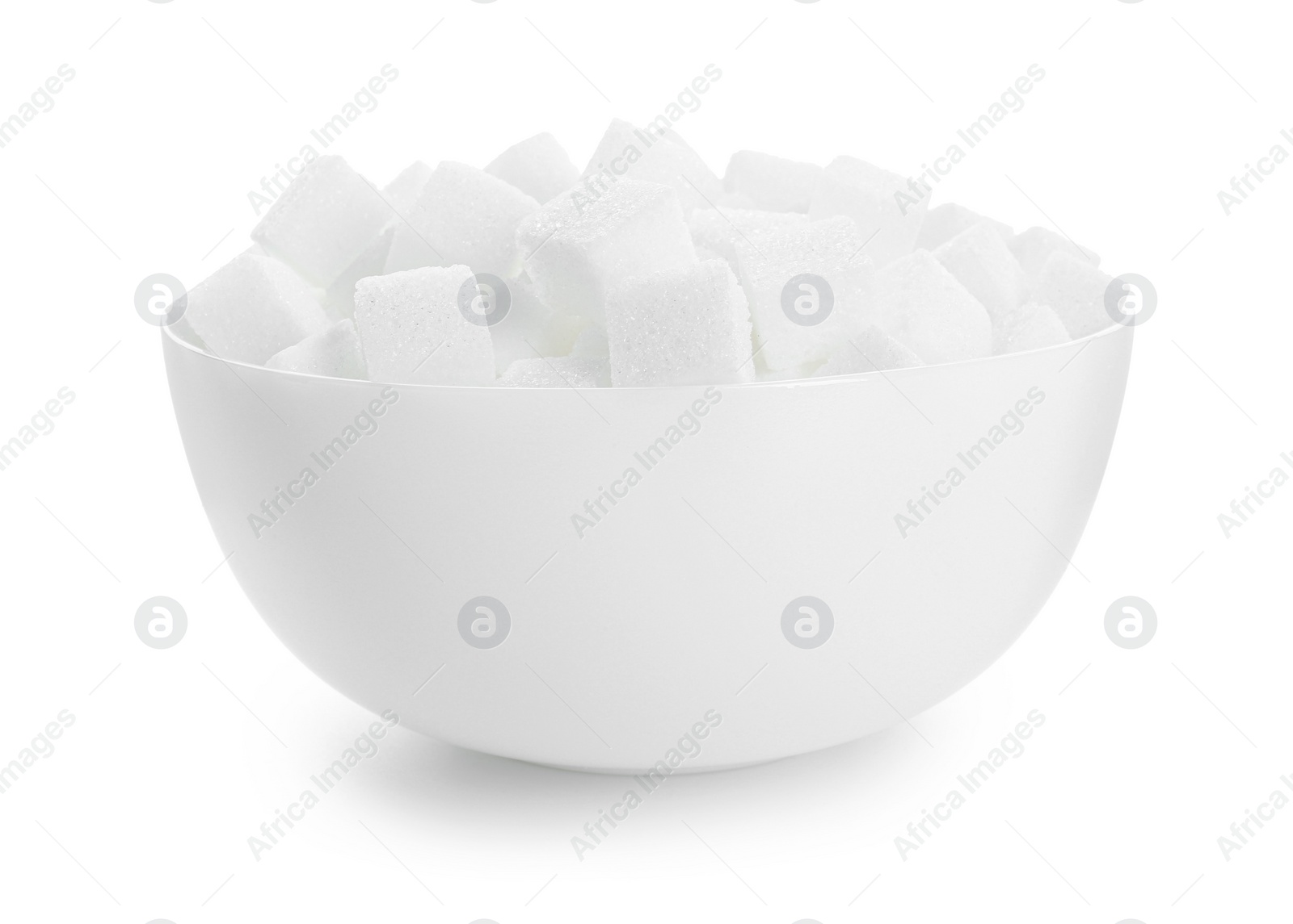 Photo of Sugar cubes in bowl isolated on white