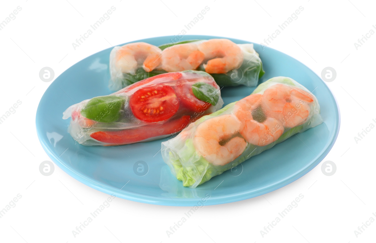 Photo of Plate of spring rolls wrapped in rice paper isolated on white