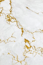 Image of Beautiful white and gold marble surface as background