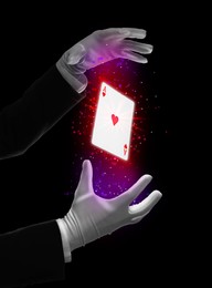 Magician performing card trick on black background, closeup