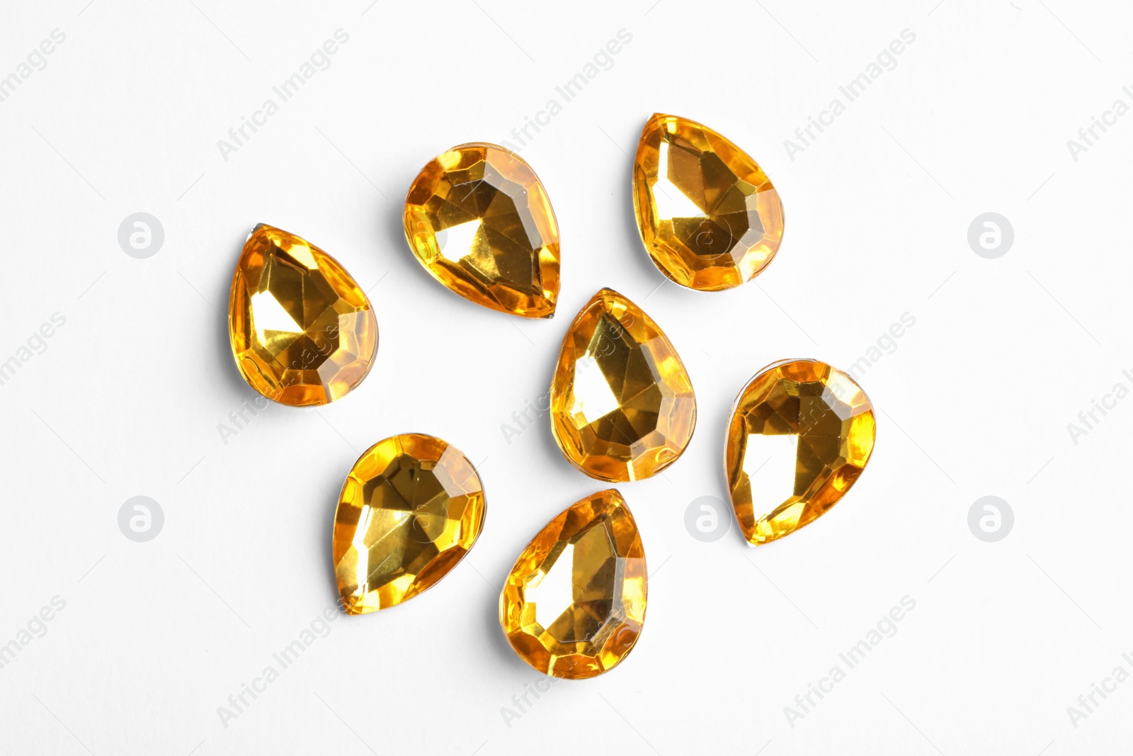 Image of Beautiful gemstones on white background, top view