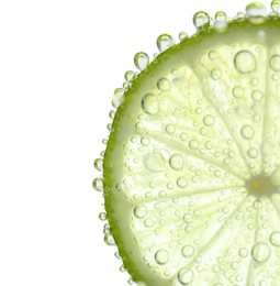 Photo of Fresh lime slice in sparkling water on white background, closeup