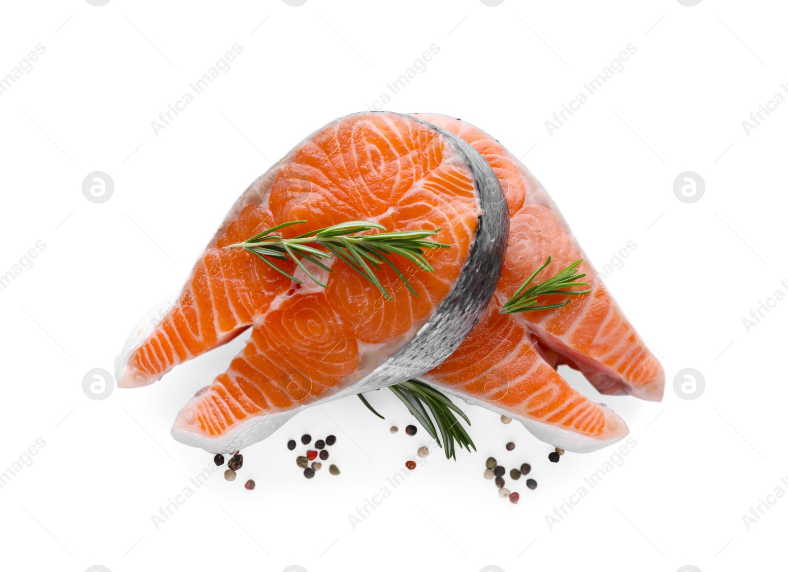 Photo of Fresh raw salmon steaks with rosemary and peppercorns on white background, top view