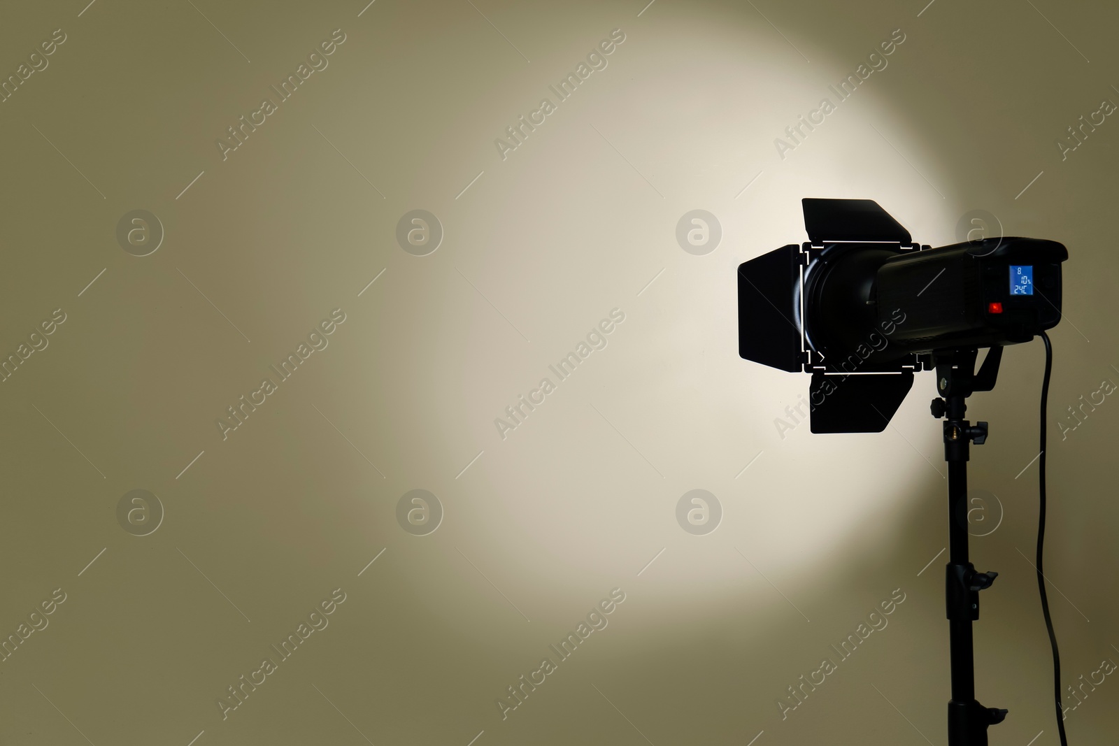 Photo of Modern spotlight against beige background, space for text