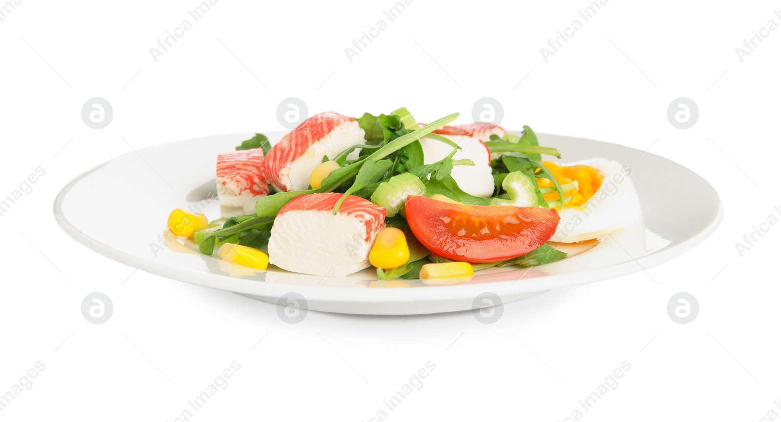 Photo of Plate with delicious crab stick salad isolated on white
