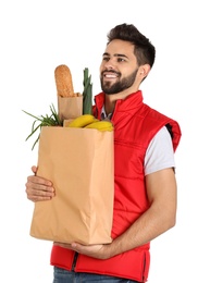 Man holding paper bag with fresh products on white background. Food delivery service