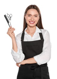 Photo of Portrait of happy hairdresser with scissors and comb on white background