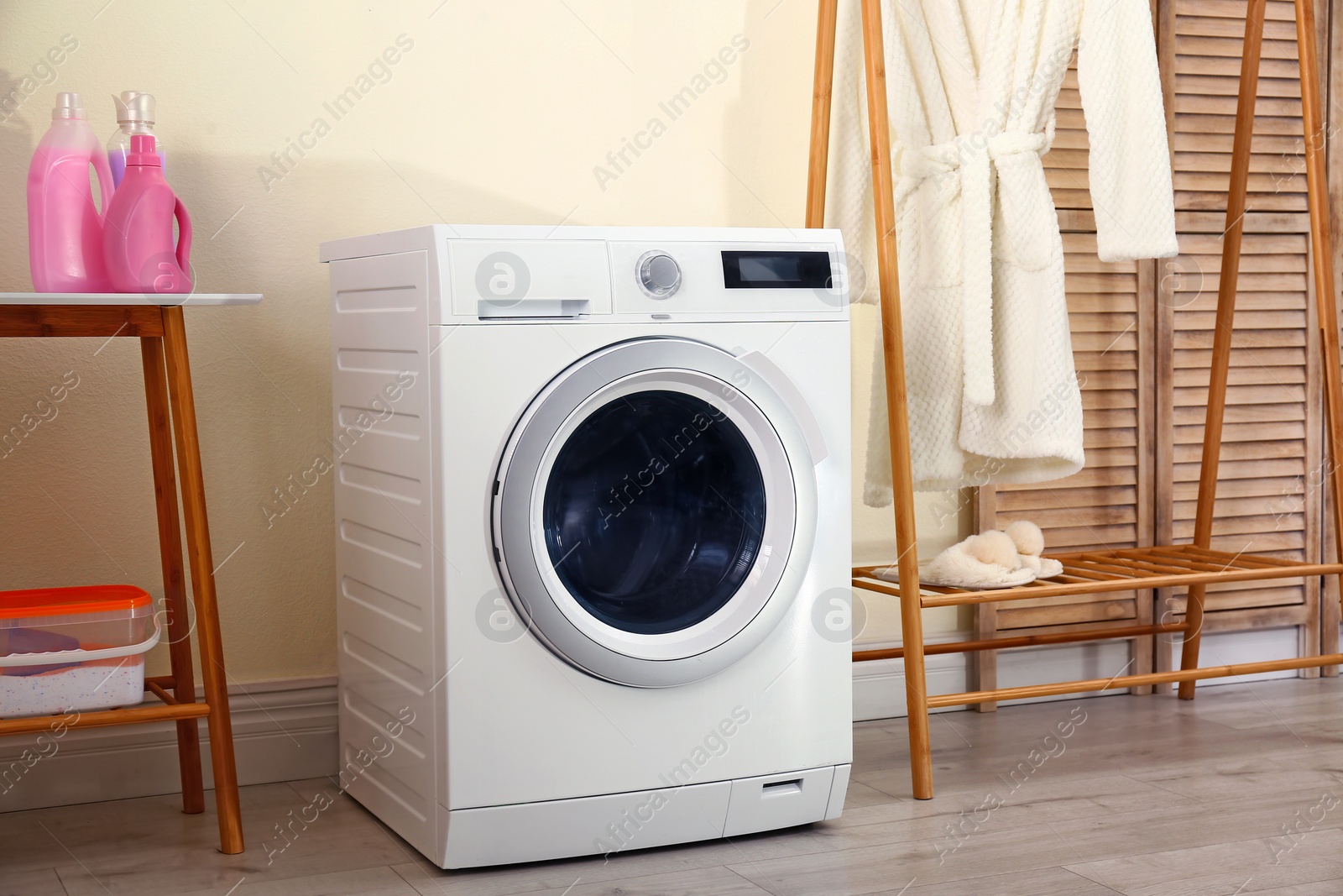 Photo of Laundry room interior with modern washing machine