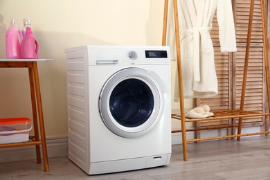 Laundry room interior with modern washing machine