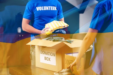 Image of Double exposure of volunteers packing donation boxes and Ukrainian flag. Help during war