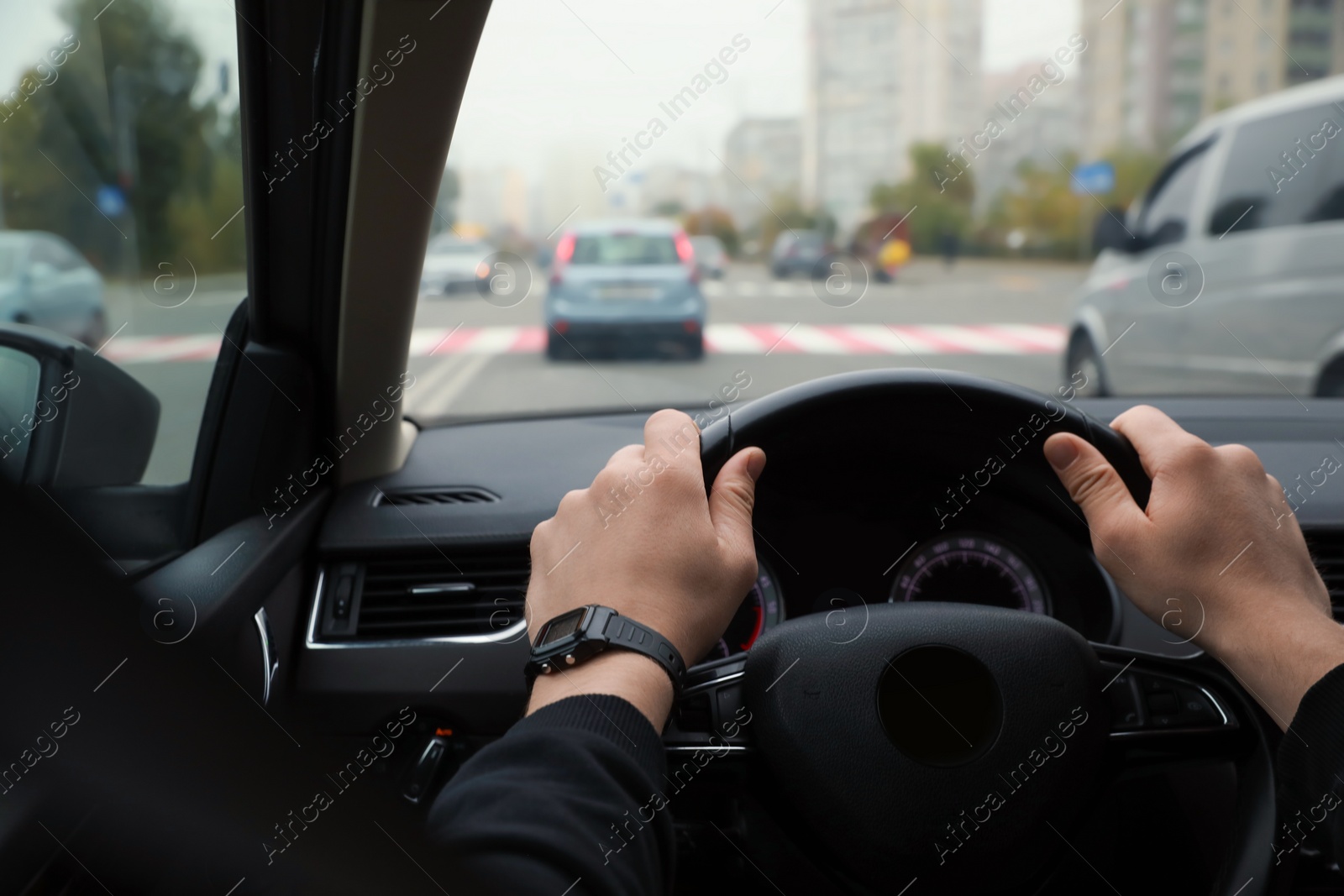 Photo of Man driving his car, closeup. Traffic rules