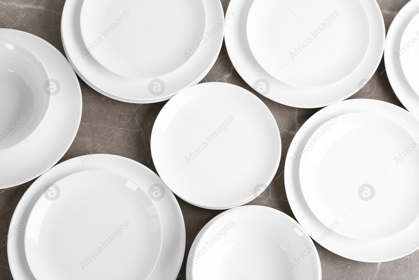 Photo of Flat lay composition with ceramic dishware on table