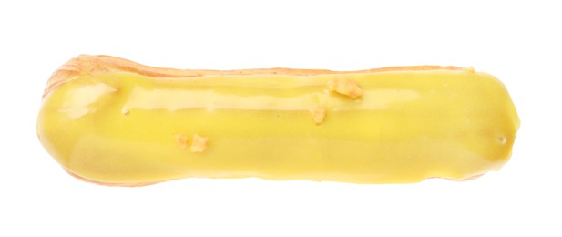 Photo of Delicious eclair covered with yellow glaze isolated on white