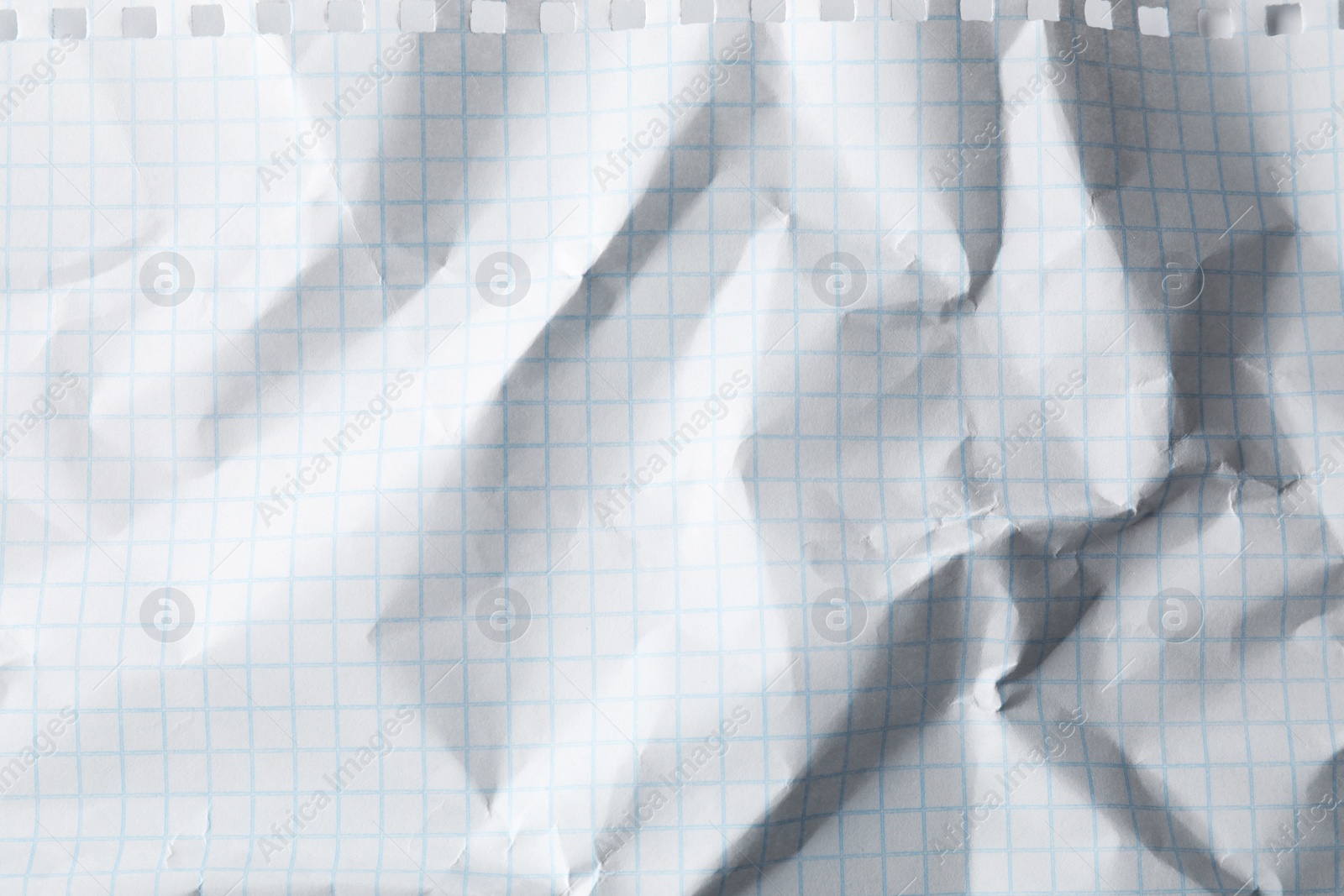 Photo of Crumpled sheet of paper as background, closeup