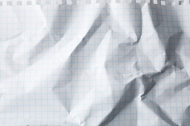 Photo of Crumpled sheet of paper as background, closeup