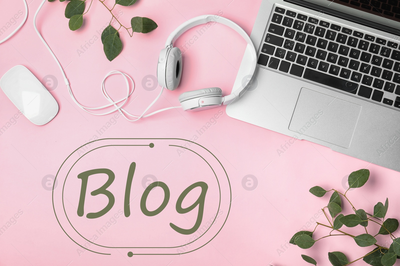 Image of Blogger's workplace with laptop and headphones on pink background, flat lay